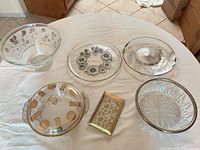 All six glass serveware pieces displayed on table