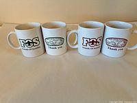 Front designs of four white Friends of Scouting Grand Canyon Council BSA mugs