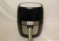 Front view showing digital control panel and exterior