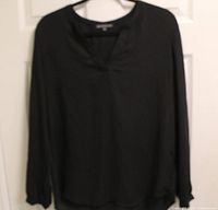 Full view of black Adrianna Papell blouse on hanger