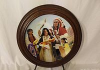 Front view of the collector plate showing artwork and wooden frame