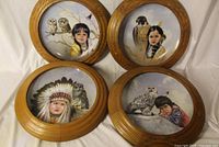 Group shot of all four framed collector plates