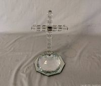 Full view of faceted crystal cross on octagonal mirrored dome base
