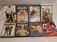 Front view of eight DVD titles in cases