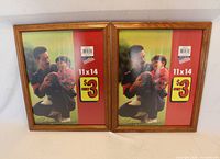 Two identical 11x14 wood-look picture frames front view