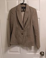Front view of Le Chateau taupe blazer jacket on hanger