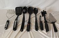 All eight kitchen utensils lined up for overview