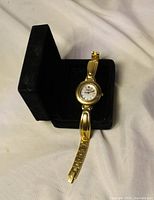 Front view of gold-tone Wittnauer ladies watch in box