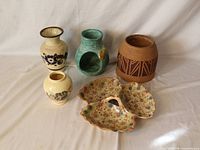 All five ceramic items displayed together showing shapes, colors, patterns, and overall condition