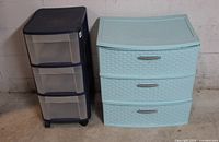 Navy blue three-drawer cart and light aqua weave three-drawer organizer side by side