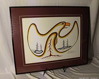 Full view of framed artwork showing bird design, matting and frame