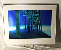 Framed colour photograph Pier at Night with white mat and frame