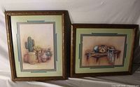 Shows both framed western still-life prints with frames and mats