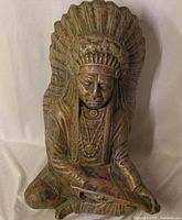 Front view of entire sculpture showing Indigenous chief details