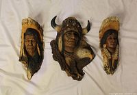 All three Neil J. Rose wall sculptures front view