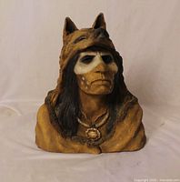 Front view of painted resin bust showing Native American face, wolf headdress and necklace