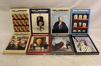 Front view of the eight DVD box sets for seasons 1-8 of Curb Your Enthusiasm