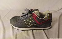 Lateral view of right shoe showing upper materials and accents