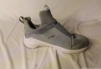 Side view of left sneaker showing upper design and color