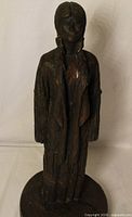 Full view of wooden statue front