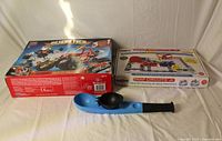 Mega Bloks Rescue Tech box, Snap Circuits Jr. box, plastic ball thrower with ball