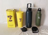 All three drinkware pieces front view with accessories and box
