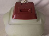 Top view of Sunbeam vaporizer showing maroon lid, translucent base and power cord