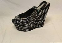 Side view of right shoe showing rhinestone-covered wedge