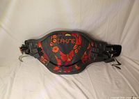 Overall view of Dakine waist harness showing graphics, straps and hook