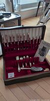 Full flatware set in burgundy velvet case