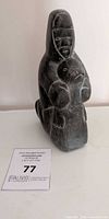 Front view of soapstone Inuit mother and child sculpture