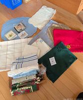 Group shot of assorted table linens on floor