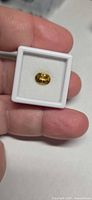 Oval yellow Tourmaline in gem box front view