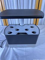 Front view showing six-pod deck, LED light hood and power cord