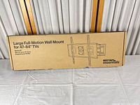 Front of boxed Best Buy Essentials full-motion wall mount