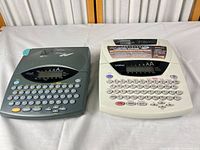 Overall view of both Brother label makers on table