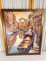 Full view of framed canal cityscape painting