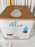 Retail box showing Ellia diffuser and essential oils