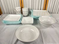 Full set showing stacked mugs, plates, bowls