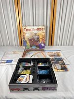 Box front, open box showing components and documents