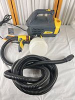 Full view of power unit, hose, gun and cup