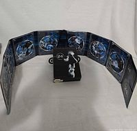 Outer slipcase and full accordion fold-out showing all seven discs