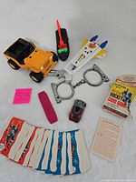 Entire lot showing card game, various toys and accessories