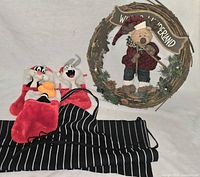 Group shot: wreath, two stockings, apron