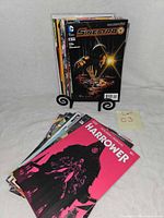 Front view showing stack of 25 comics on stand with Sinestro #8 and Harrower #1 visible