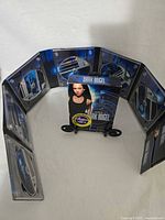 Fold-out case fully opened showing six DVDs and outer cover