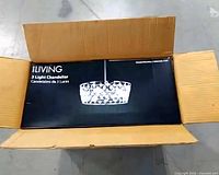 Boxed ILIVING chandelier showing branding
