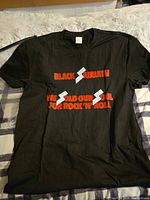 Full view of front of black T-shirt with graphic