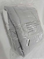 Front view of sealed grey comforter