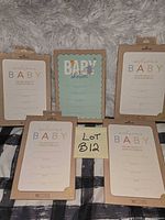Front view showing four sealed Hallmark invitation packs and one loose sample card